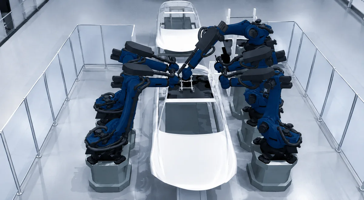 Virtuelle Roboterzelle mit mehreren Robotern an einer Fahrzeugkarosserie
